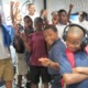 music education, STEM and hearing impairment grants: group of black youths listening to music and learning
