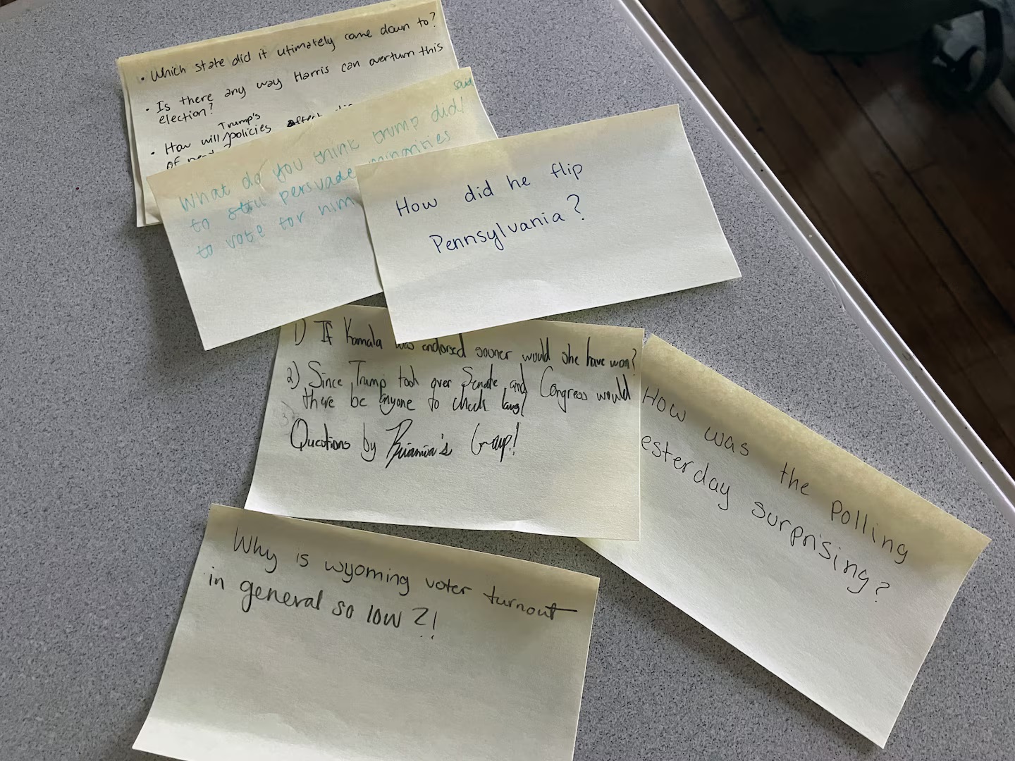 Teachers toss their lesson plans, give students the floor to grapple with Trump win: sticky notes with students' thoughts and questions written on them
